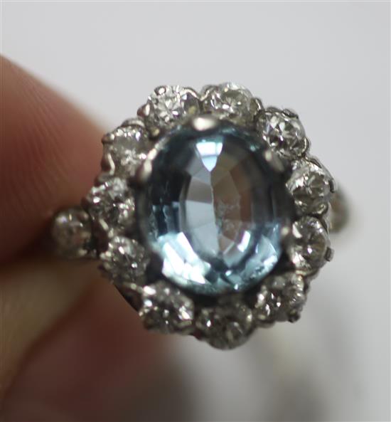 A mid 20th century aquamarine and diamond oval cluster ring, by Tiffany & Co, size M.